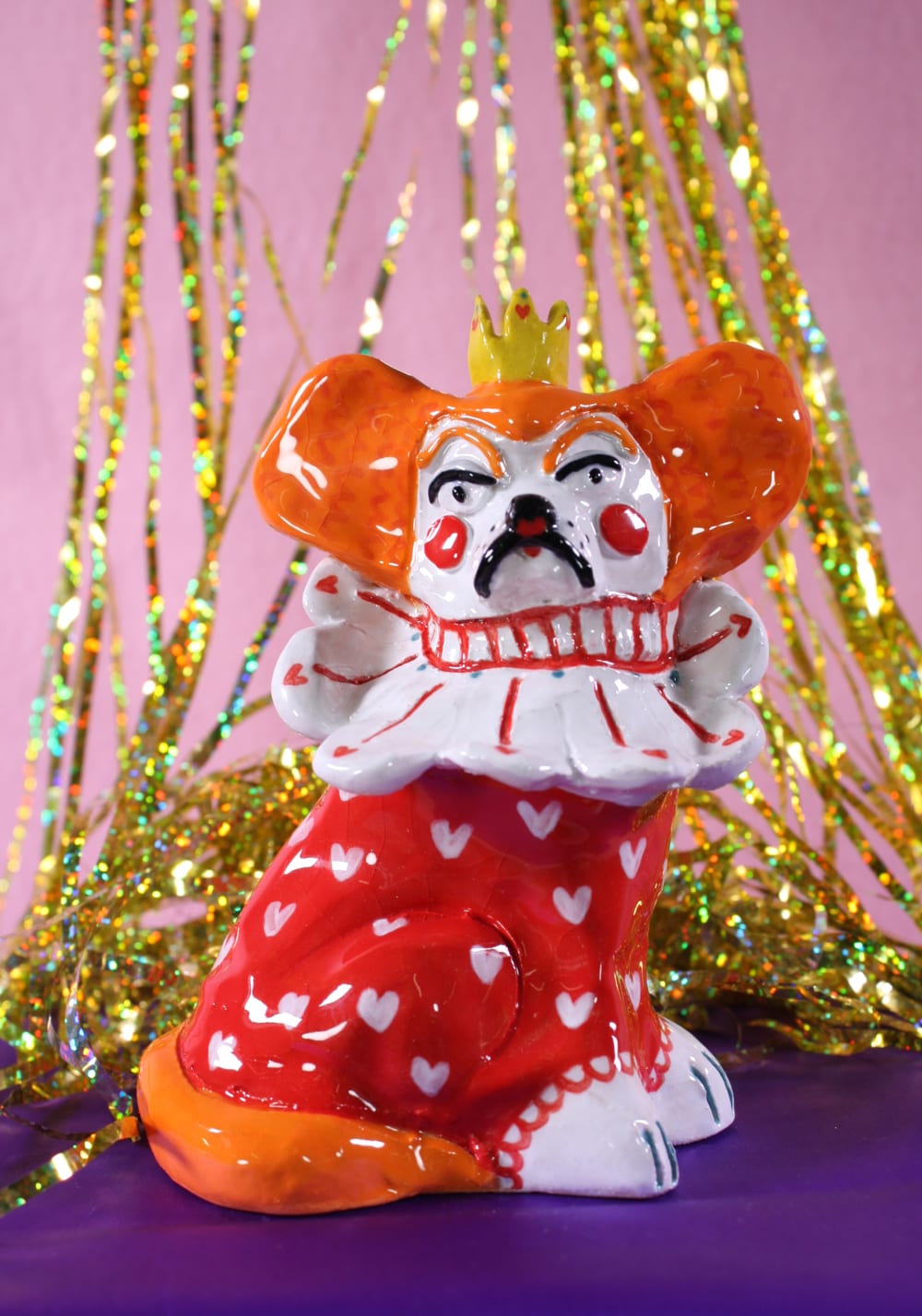 Ceramic dog dressed as a queen