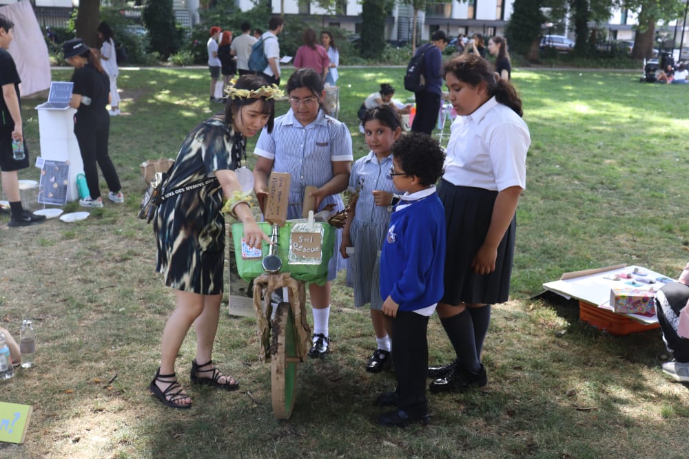children looking at a bike