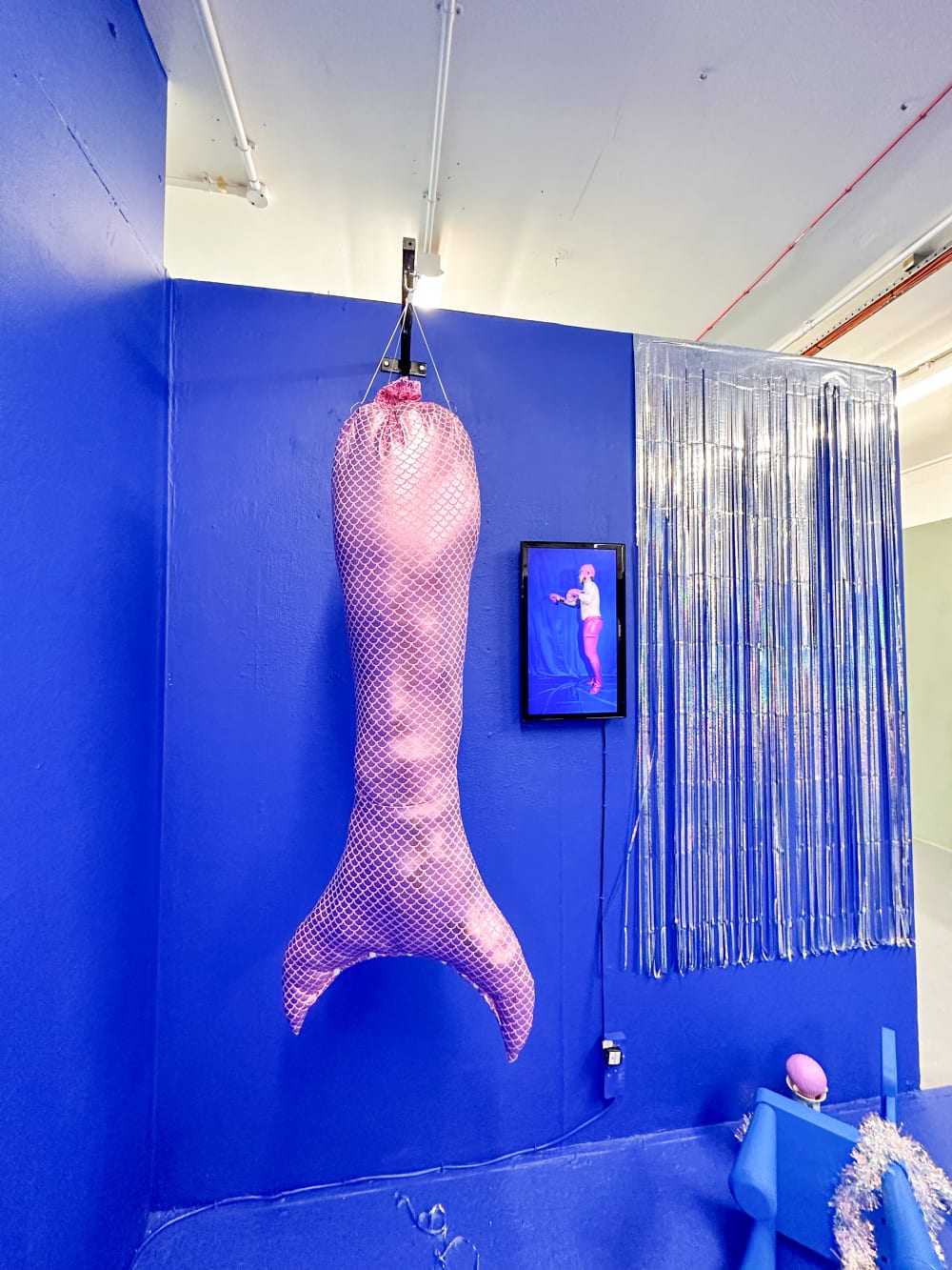 a punching bag in the shape of a fish tail
