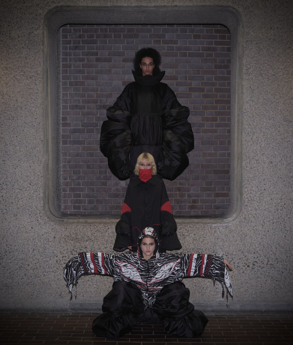 Photograph of 3 outfits on models