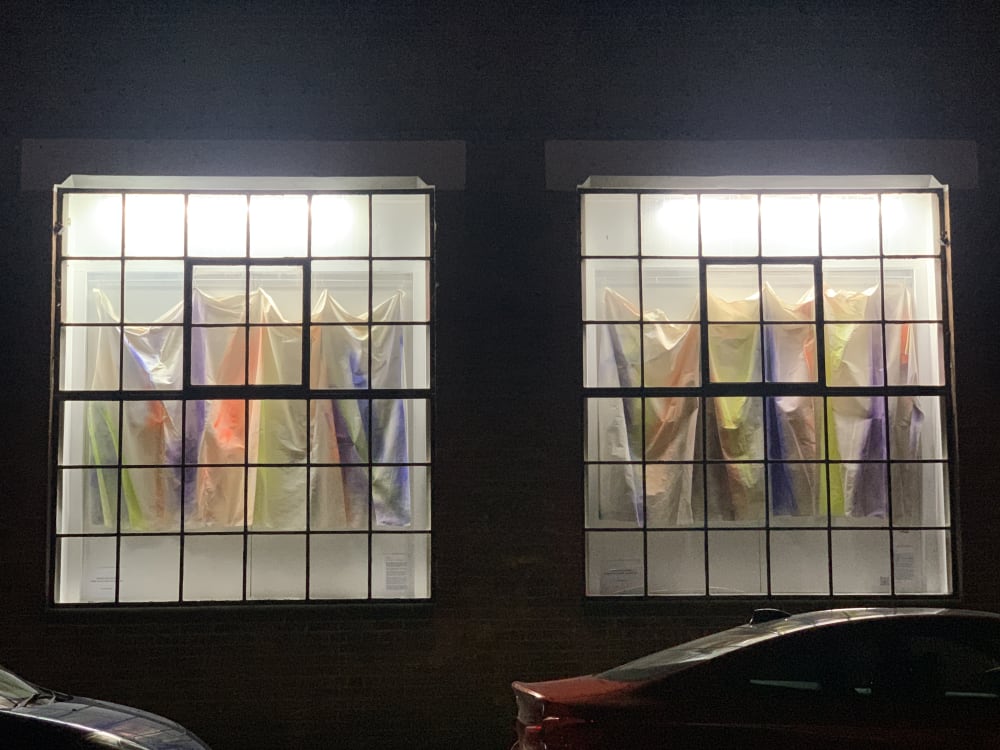 'Behind the curtain' hanging in the window in 2024