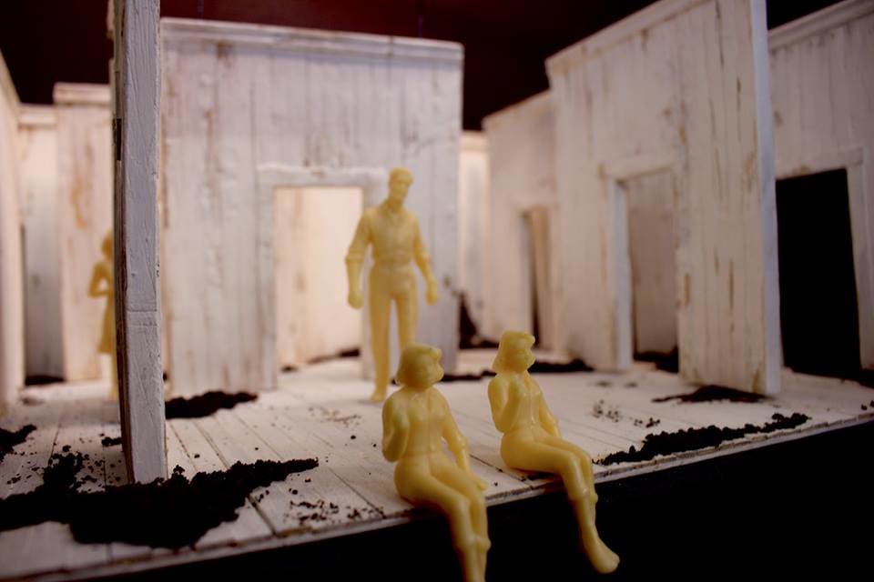 A model box set with three female figures and one male figure on.