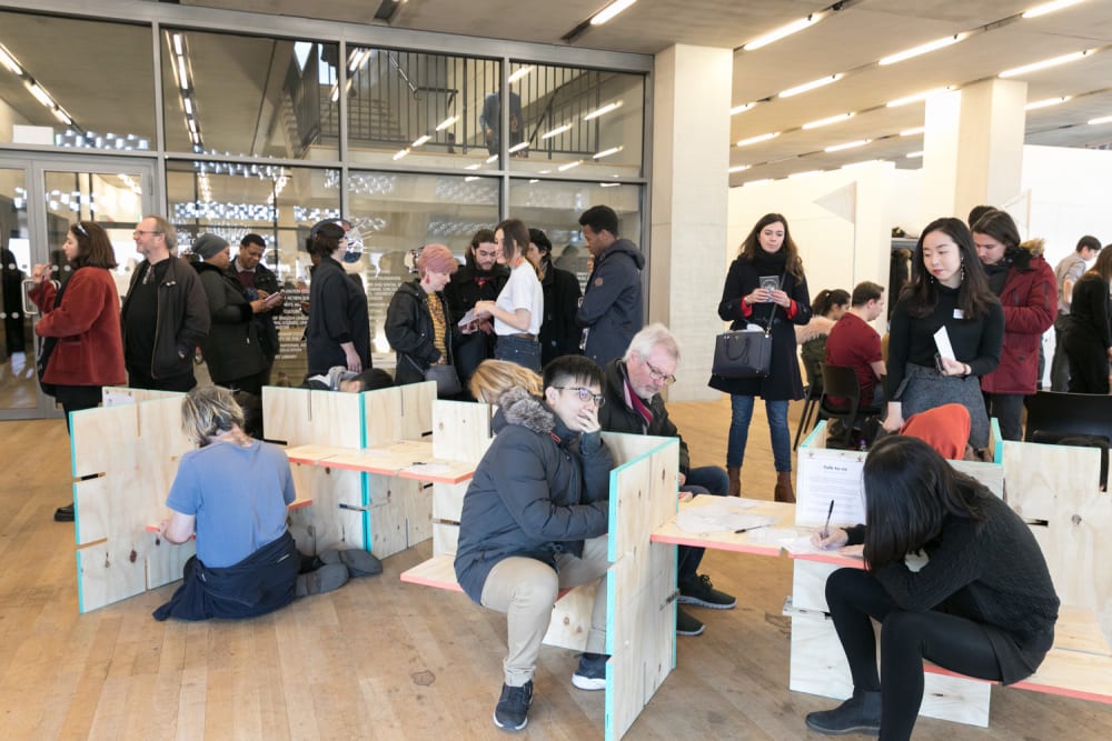 Lend with Care - Tate Exchange Event - large group of the public writing 