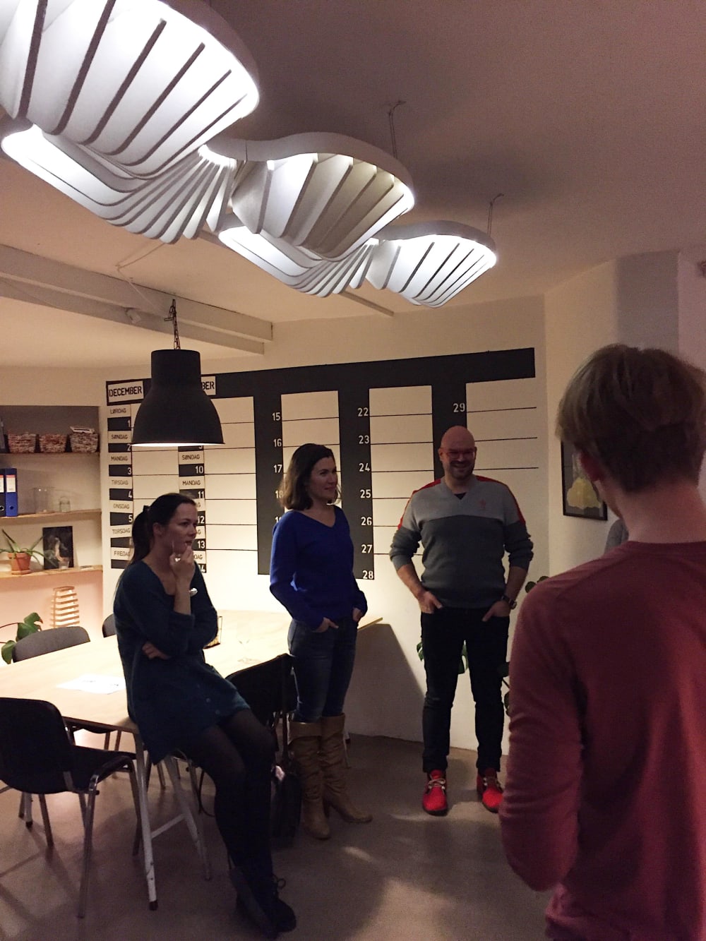 Four people chatting in a room