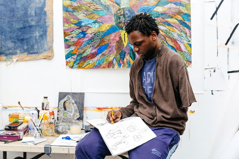 Image of man drawing in the studio