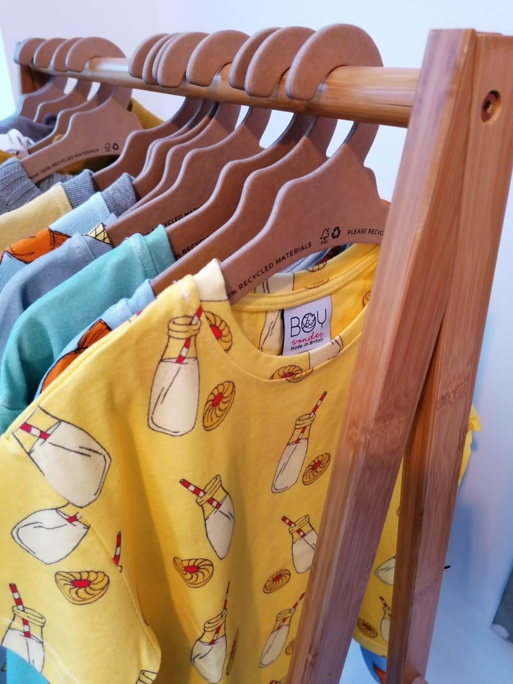 Clothes hanging on wooden hangers