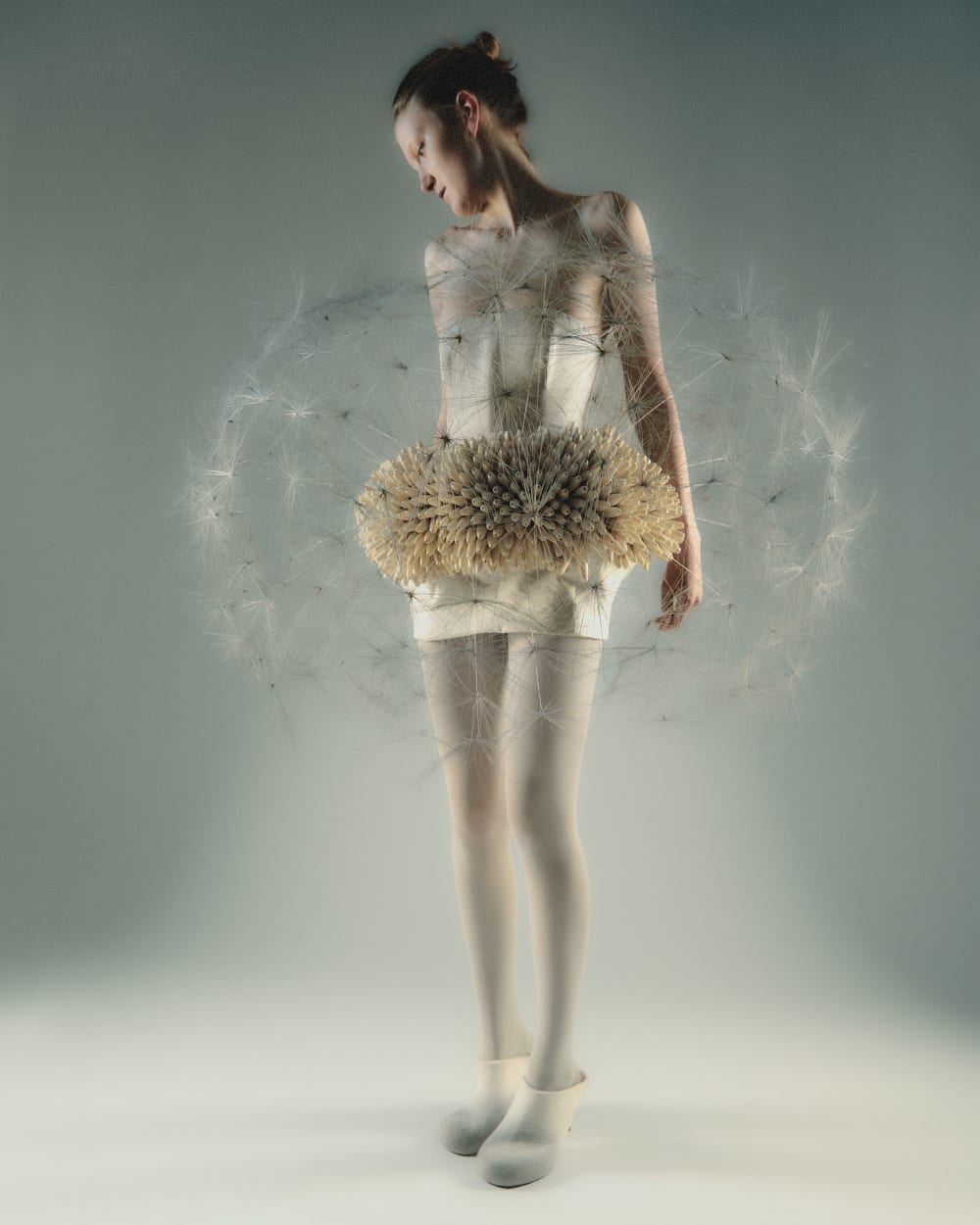 Figure wearing dress like a dandelion