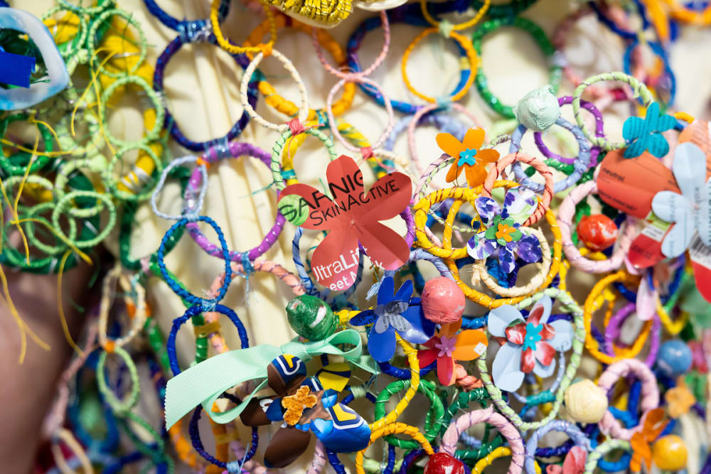 Close-up of Grayson's robes showing thousands of plastic flowers and cutouts.