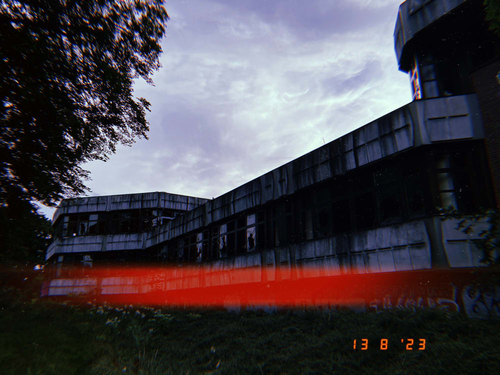 Image of a derelict looking building with graffiti on it.