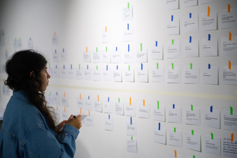 Image of Showcase attendee viewing Climate Compass display
