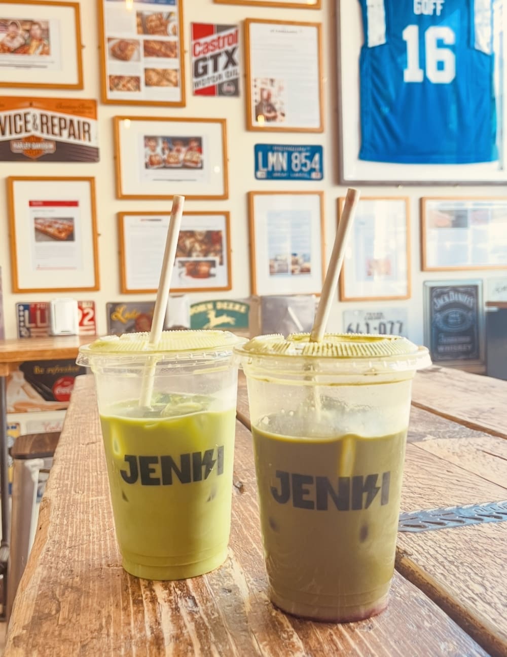 Two matcha lattes in plastic cups 