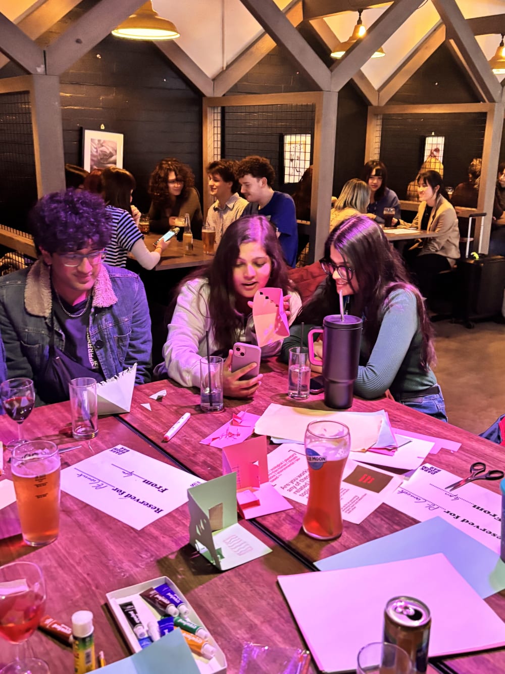 People crafting around a table