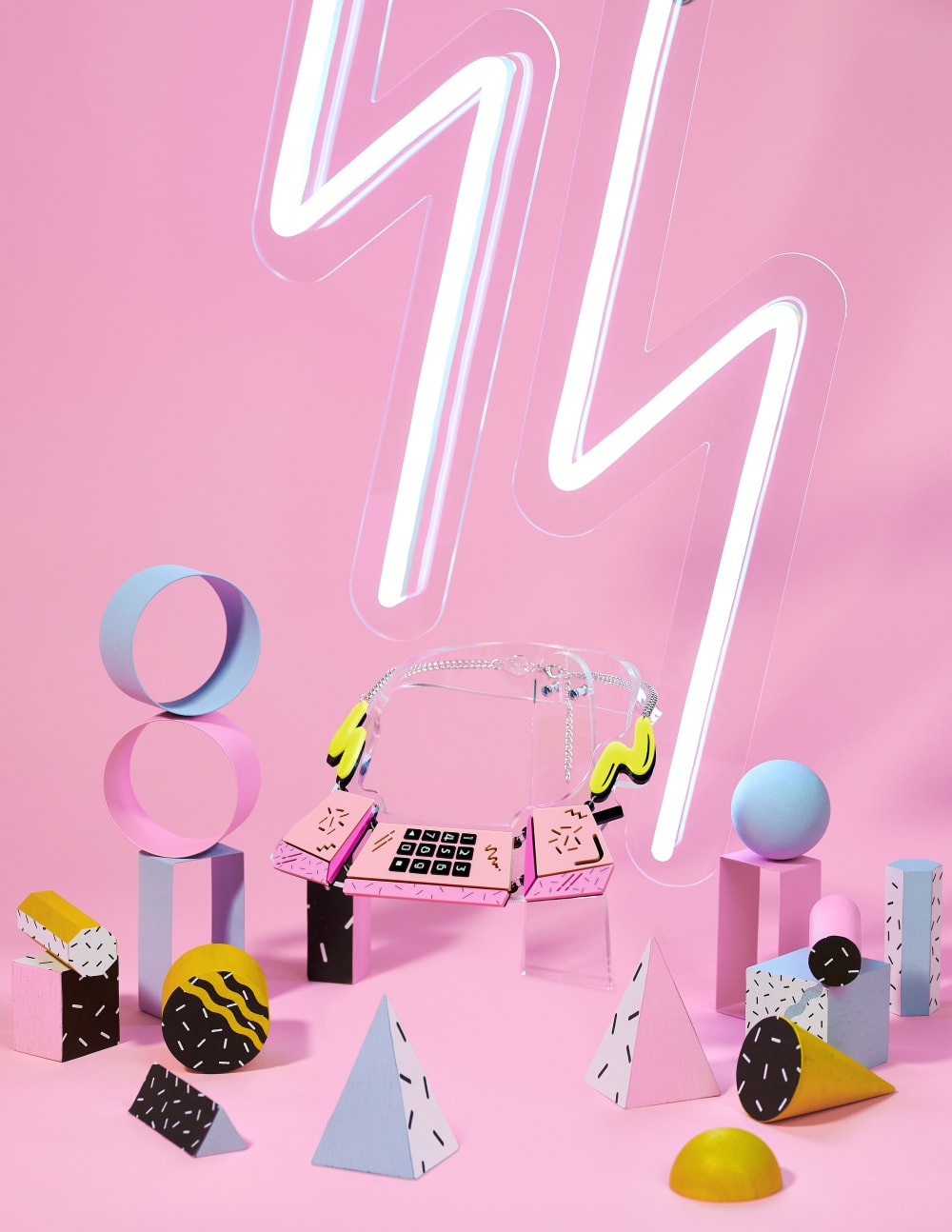 Phone-inspired necklace within pink 80s Memphis set