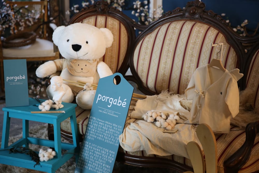 White teddy bear on a chair