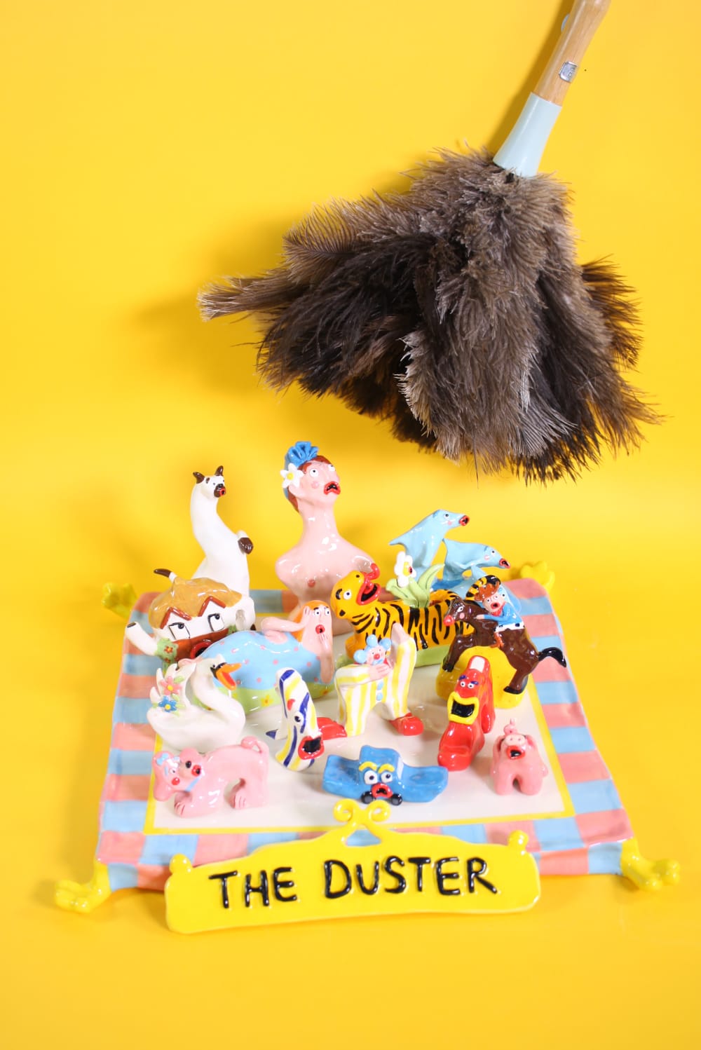 Collection of ceramic characters with a duster