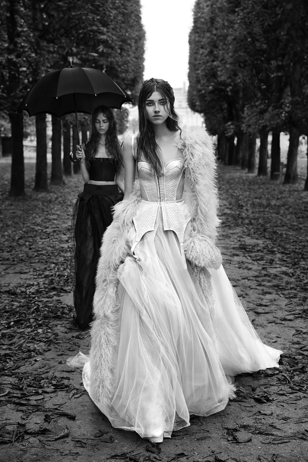 Black and white image of two women in wedding dresses