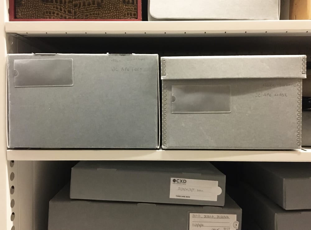Outside of archive boxes on a shelf