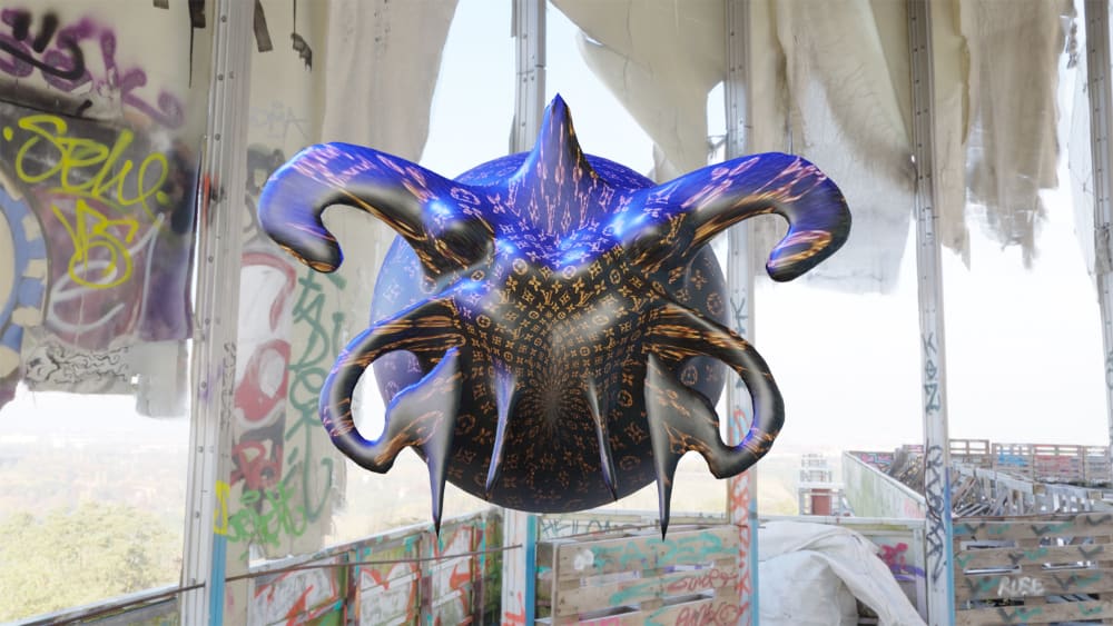 An abstract digitally created shape, named Alien, floating centrally, the shape is filled with a Louis Vuitton design pattern. The shape is floating in a graffitied building.