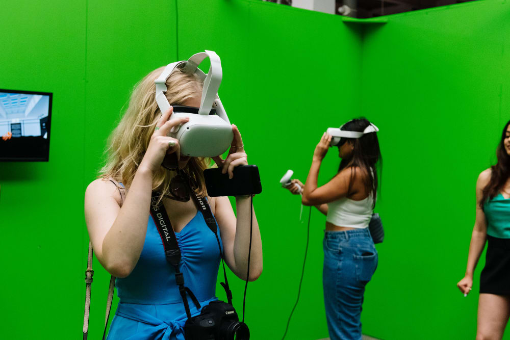 Green screen background with girl using VR headset