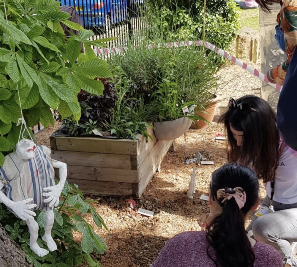 people kneeling in a garden