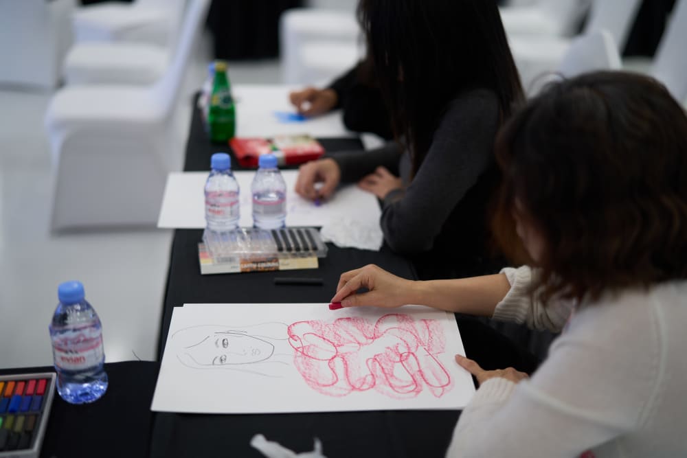 Drawing of a model with the clothes shown as red squiggles