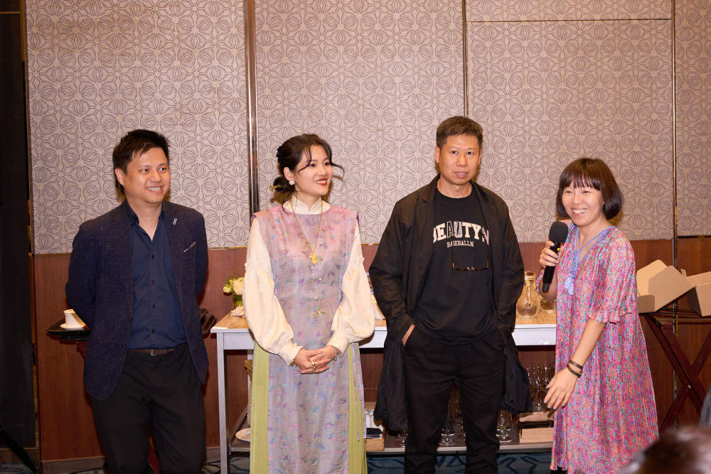 Alumni volunteers giving a speech