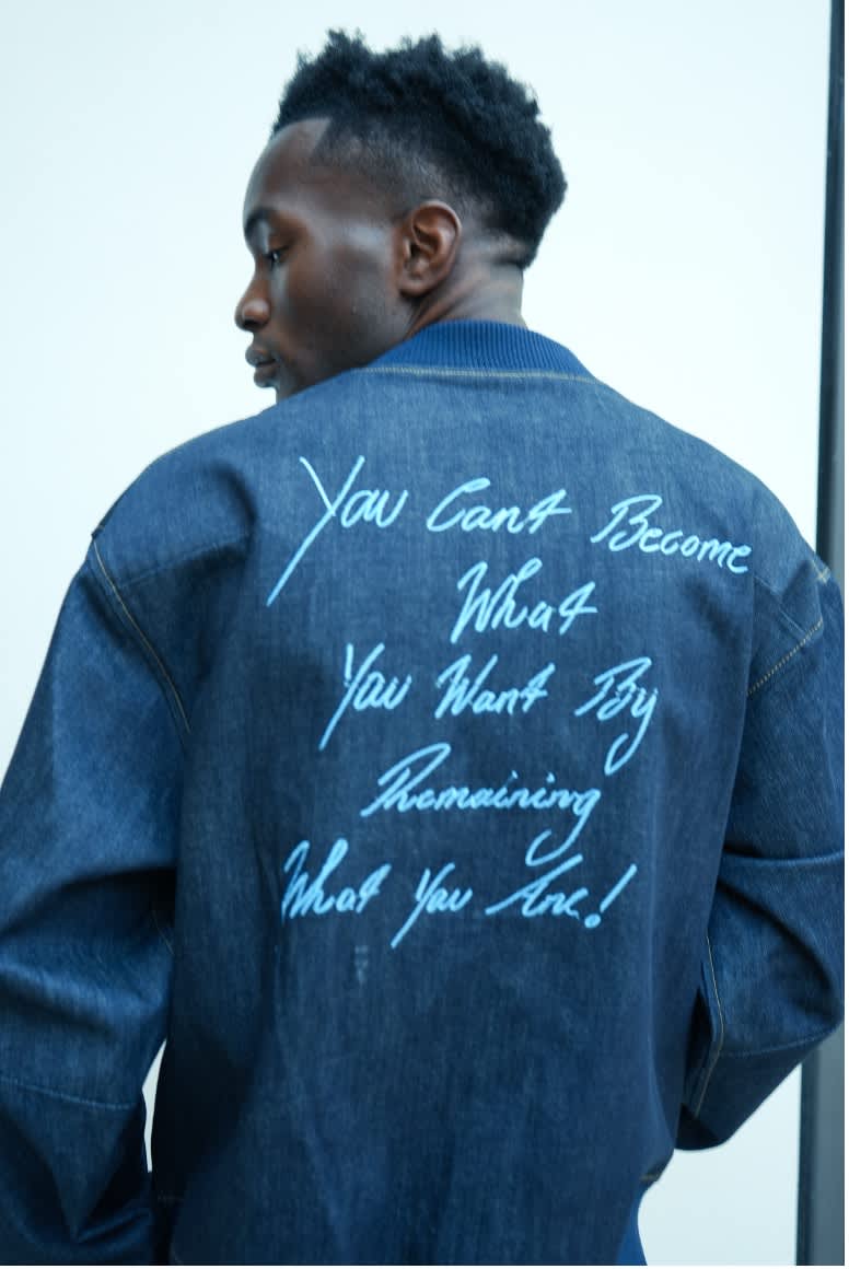 An image of a man showing of his jacket