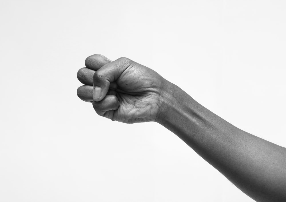 A black and white hand making a fist