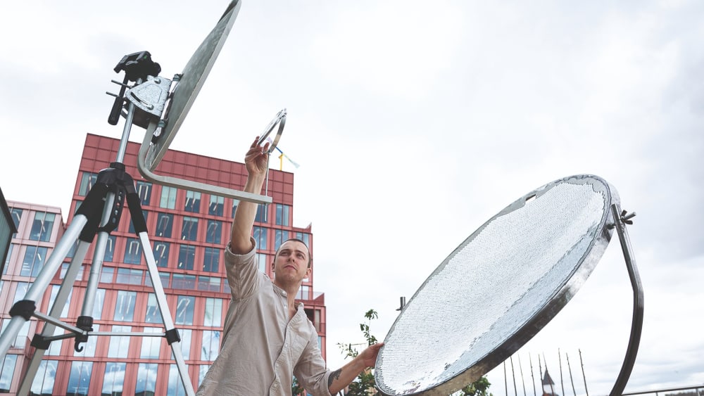 Sean Ross adjusting his Solar Forge created for the Swarovski Conscious Design proejct