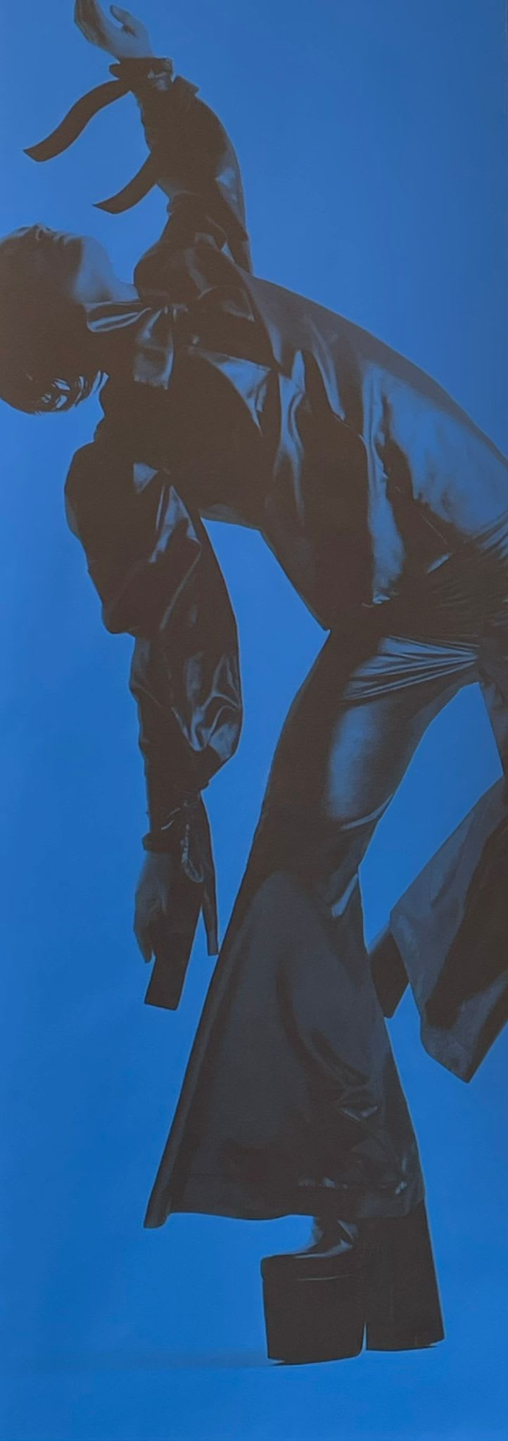 Blue artwork of dancing man in platform boots