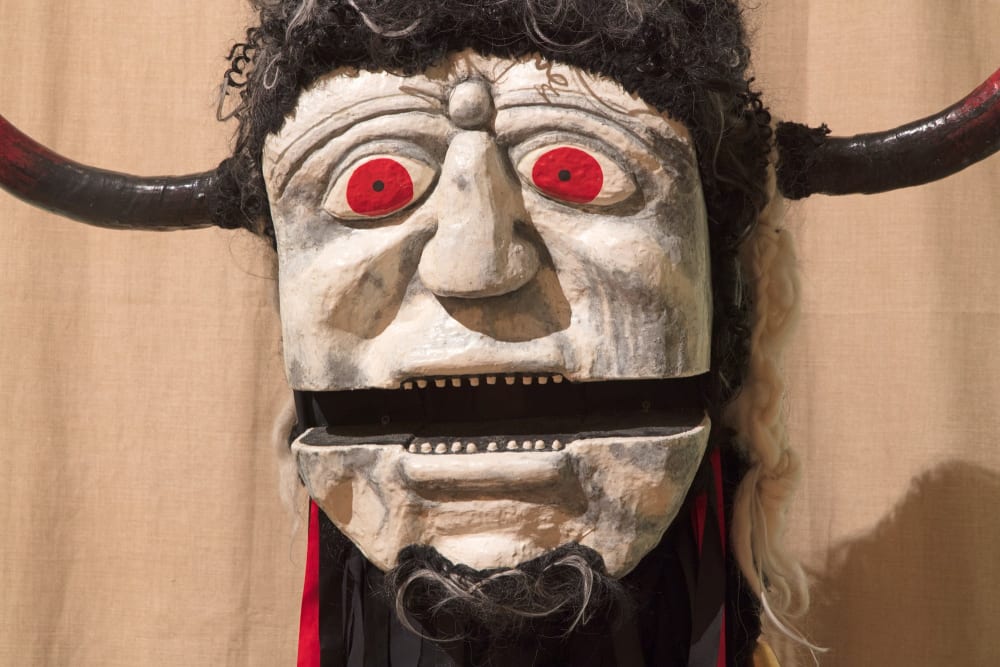 Darkest Ooser - large head with horns and red eyes