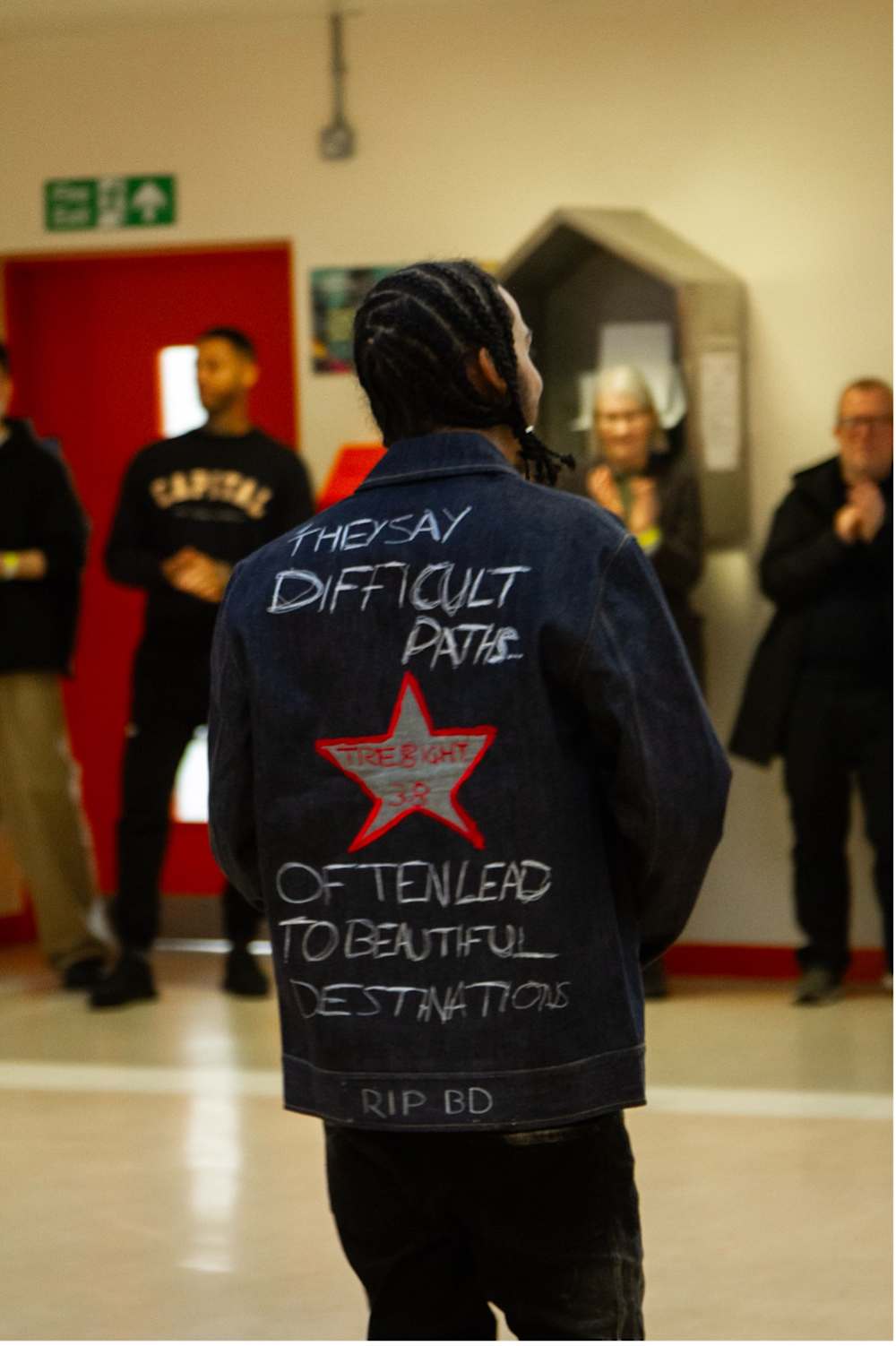 An image of a man showing of his jacket