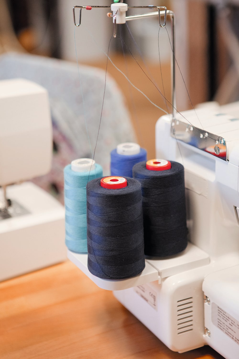 Image of thread reels on a sewing machine