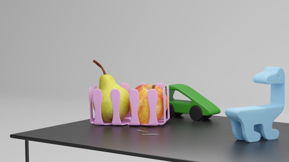 Table displaying Conor's toys and some fruit