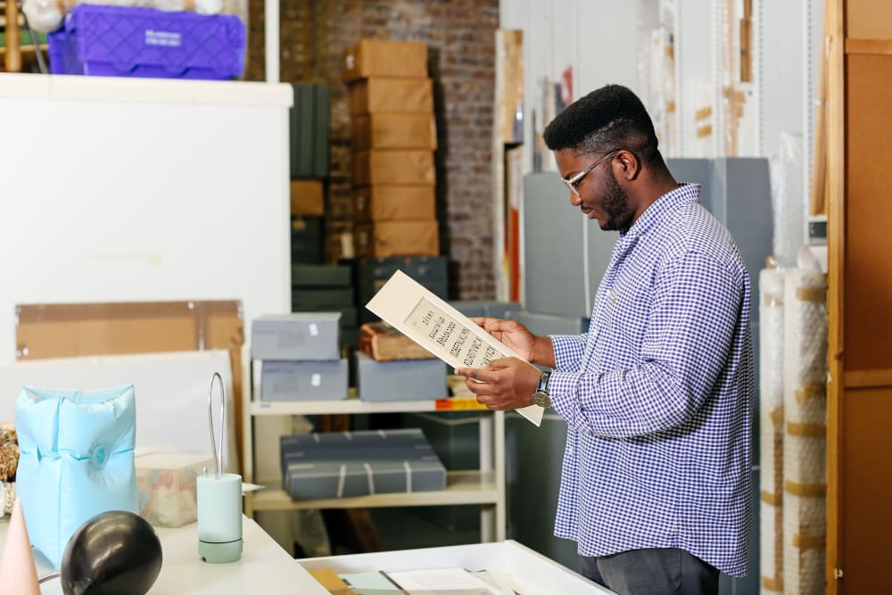 A man looking at a print