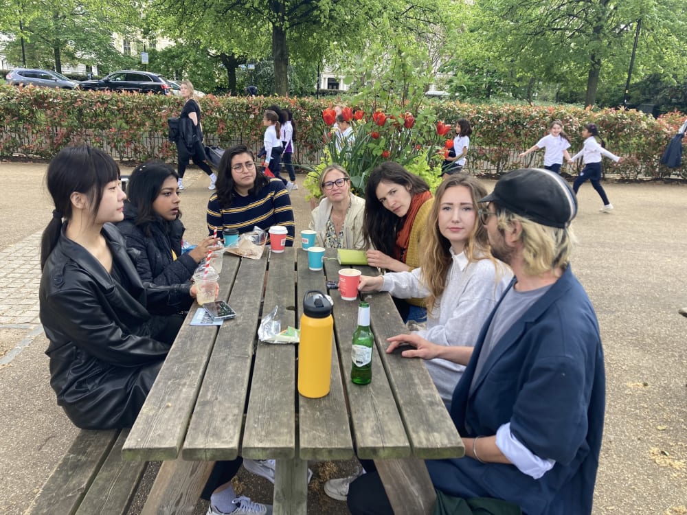 Postgraduate students at an outside cafe