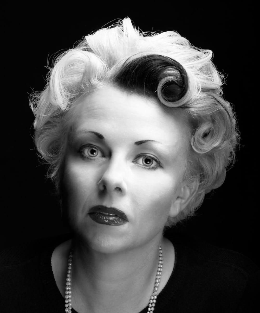 a black and white photograph of Cathi Unsworth