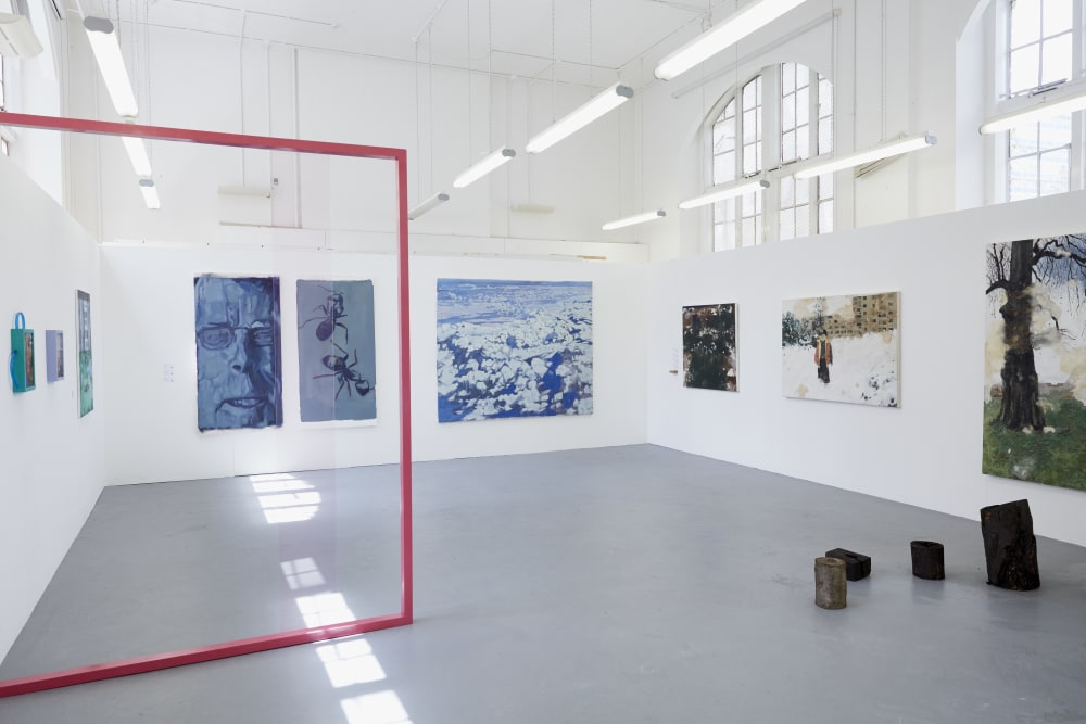 An installation shot of various paintings from 2023 Fine Art: Painting students