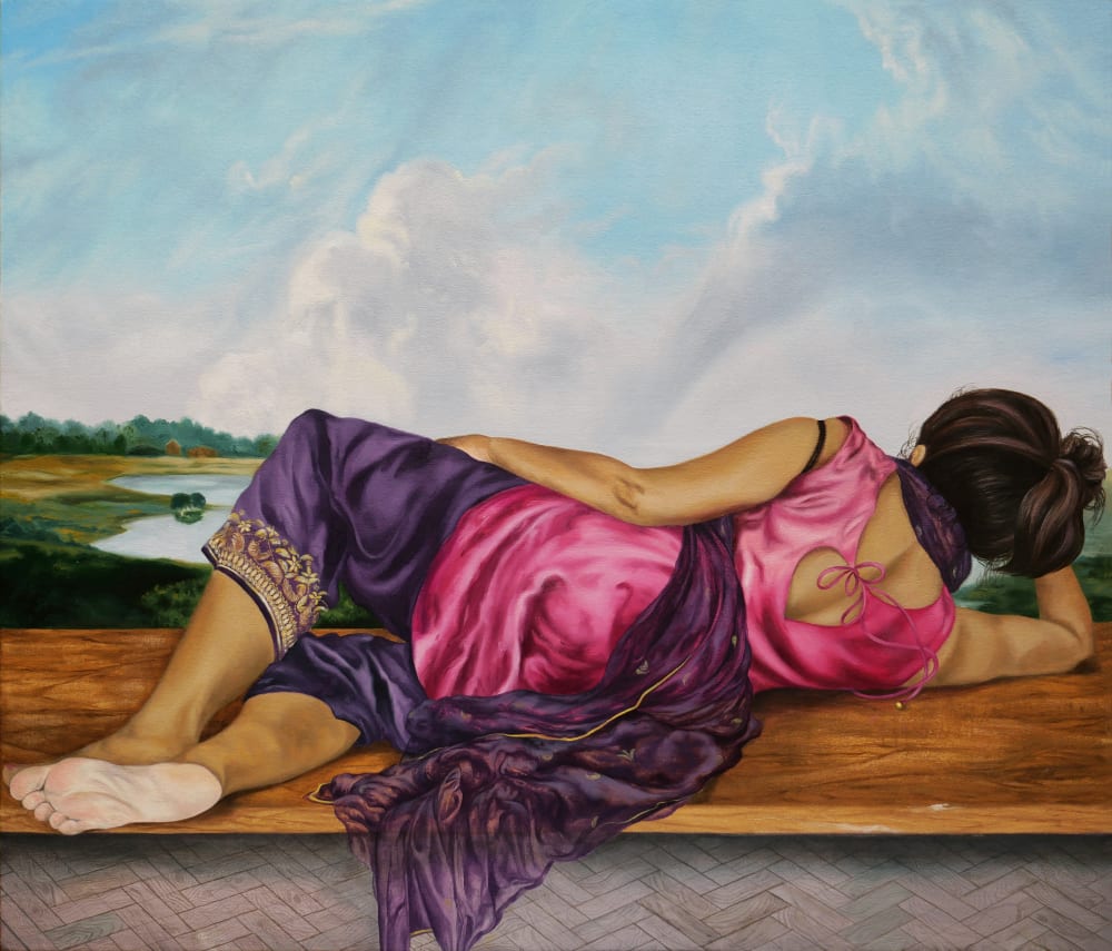 A portrait of the back of a woman, lying on her side looking out across the landscape