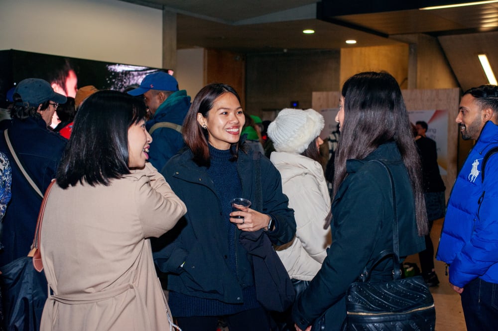 Guests chatting and smiling