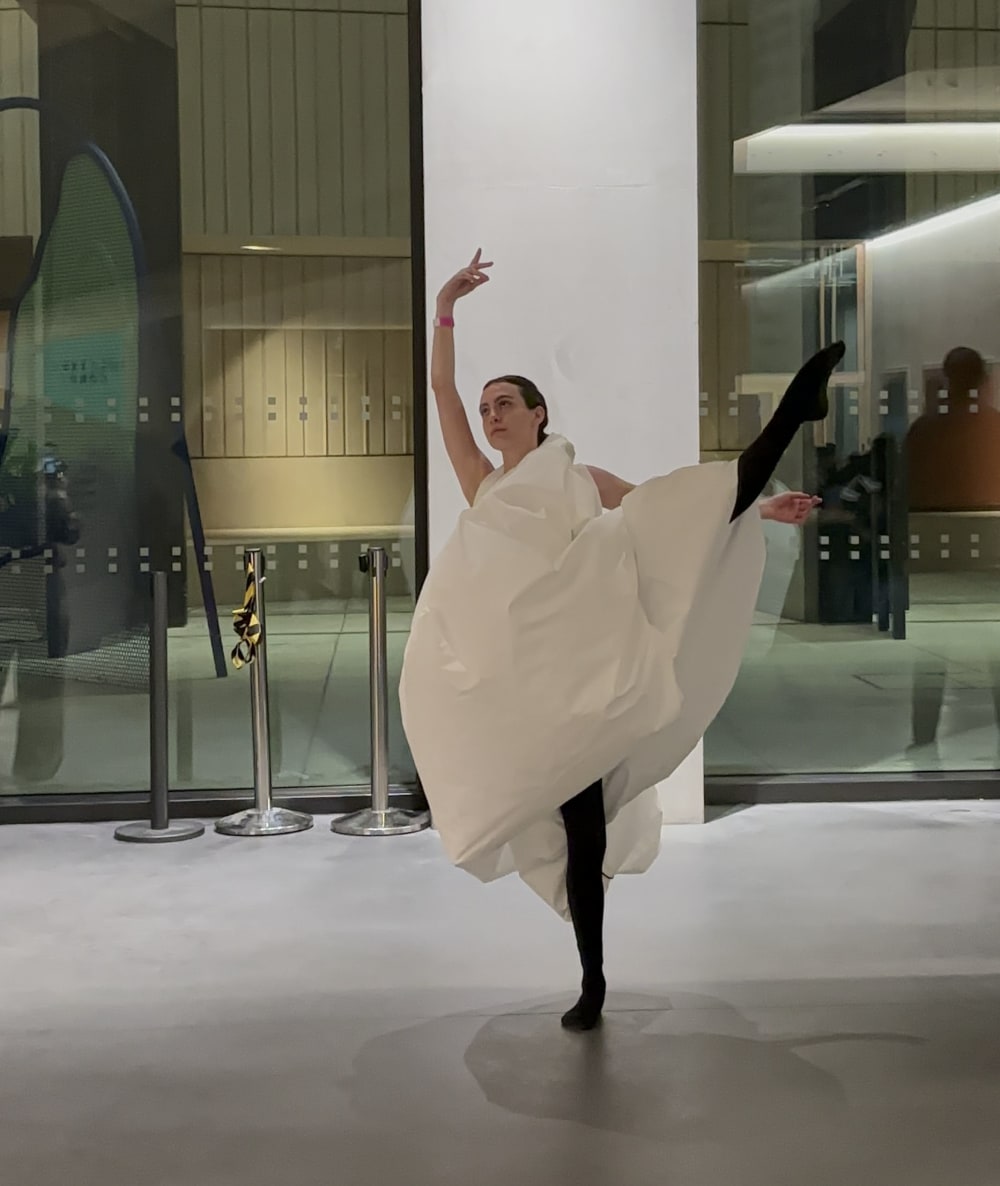 Person in white dress dancing