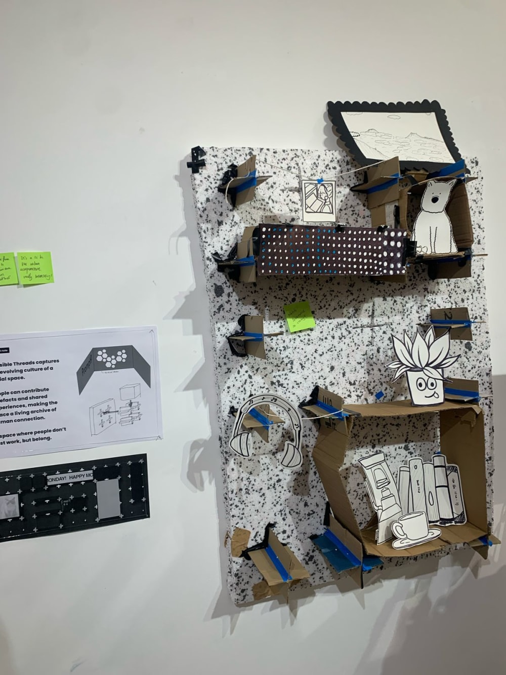 posters being displayed on a wall