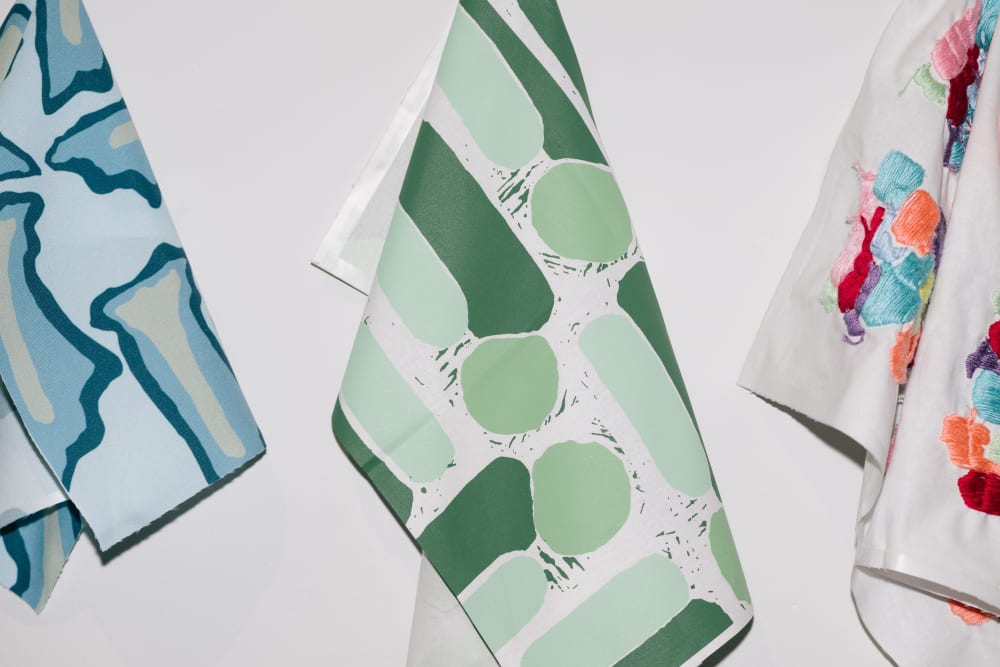 Colourful hanging cloth in green blue and multicoloured.