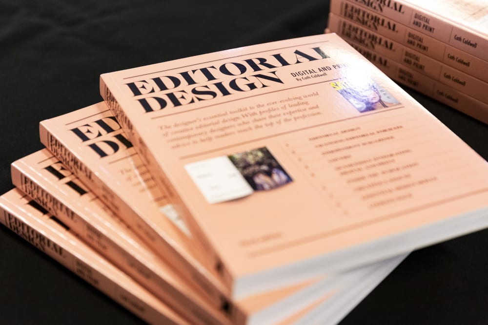 Editorial Design books fanned out on a table