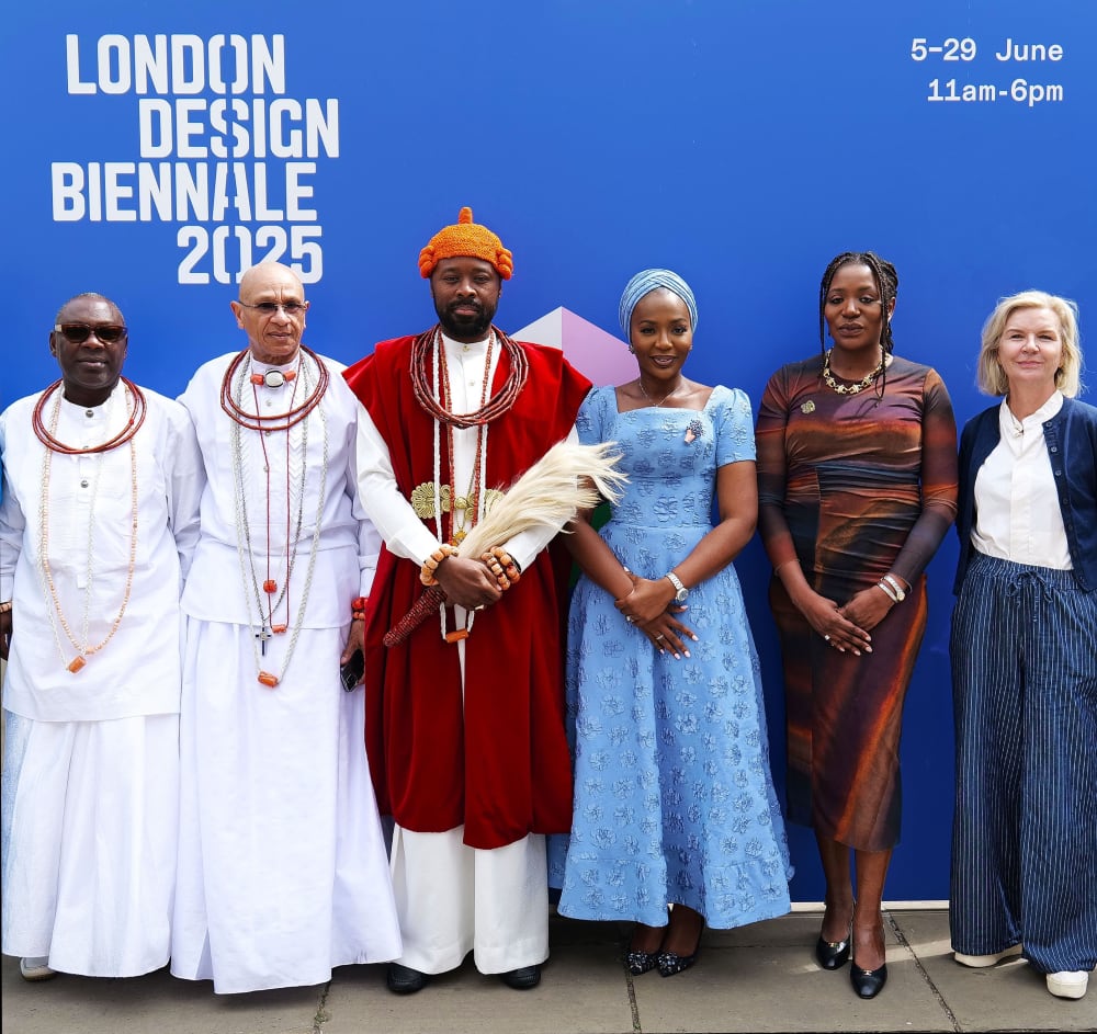 group of people smiling at the camera for the Royal visit to Nigeria Pavilion