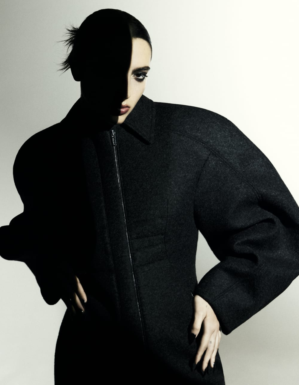 Fashion magazine page with a model wearing black clothes