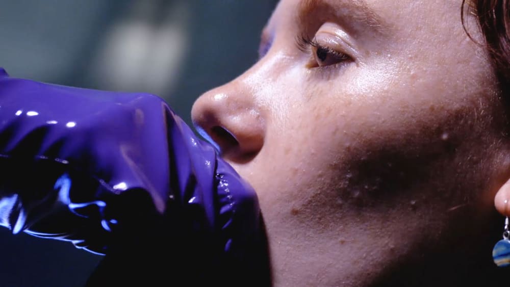 woman with purple gloves