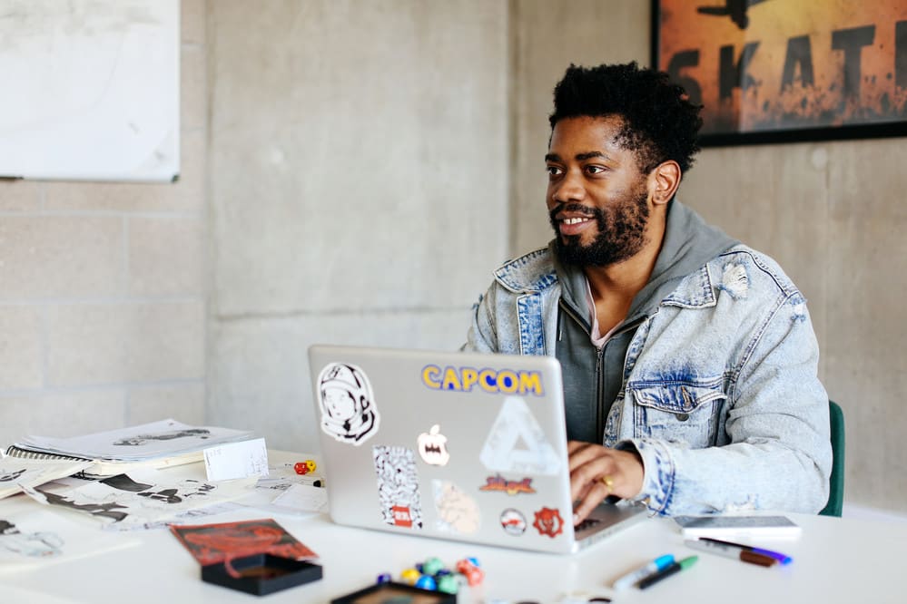 man sitting at laptop