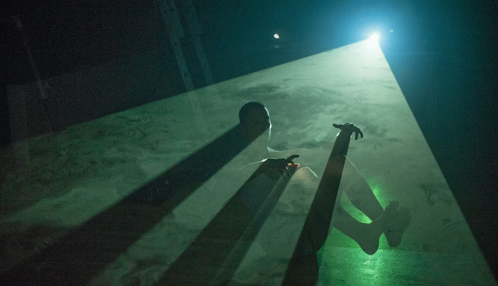 Green stage lighting display and performer