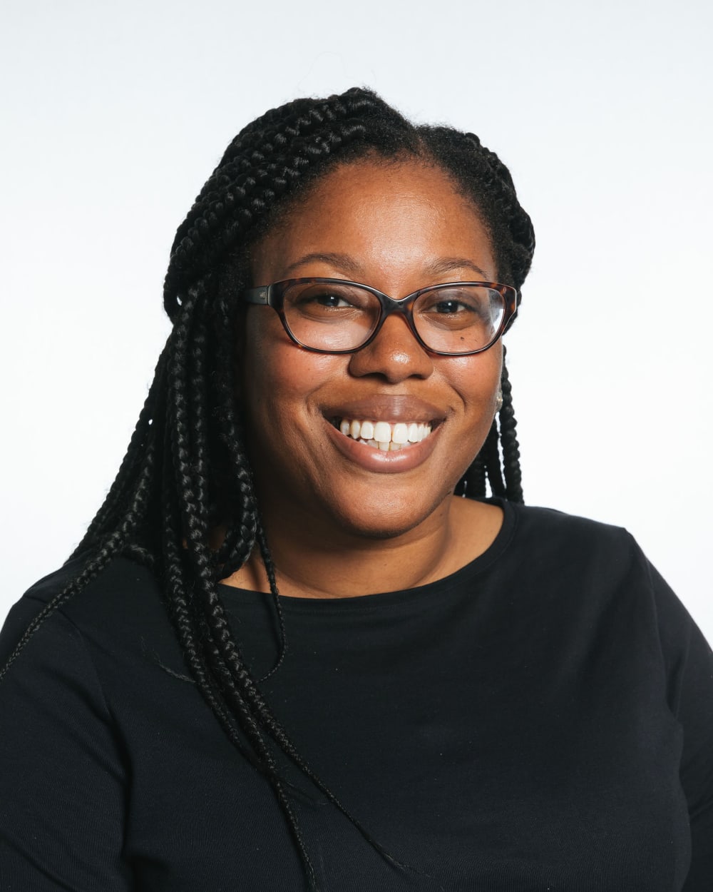 Marenka Thompson-Odlum smiling against a white backdrop